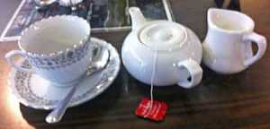 Photo of tea cup, pot, milk jug